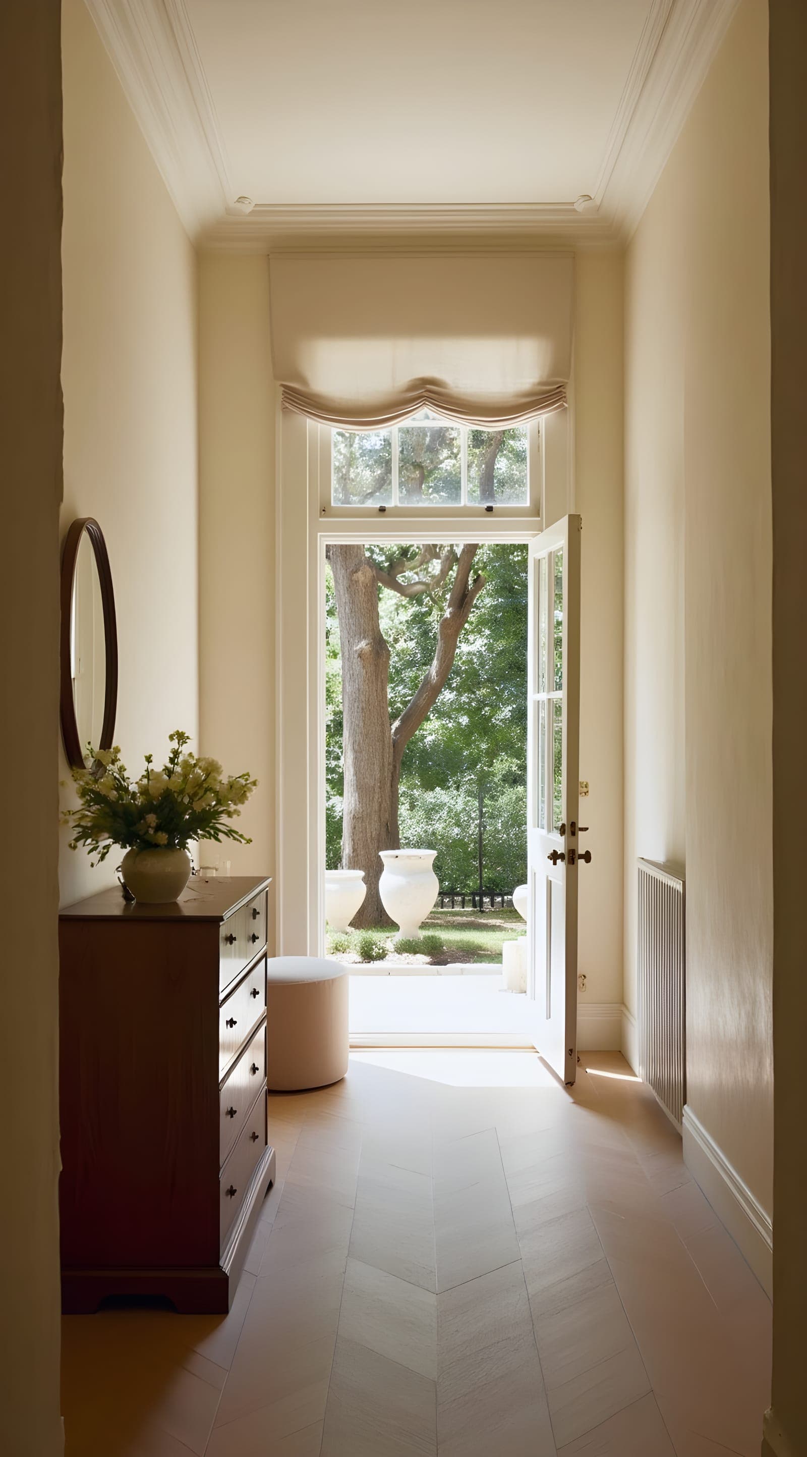A panelled hall opening onto a garden